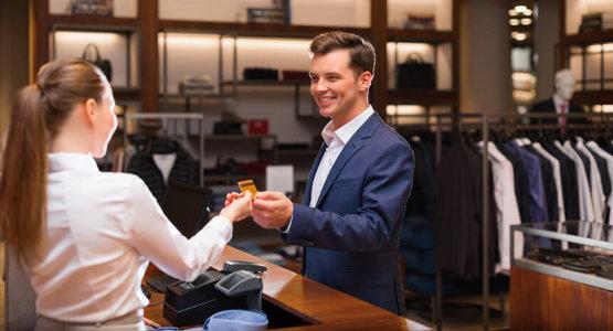 Young man checking out at retail store