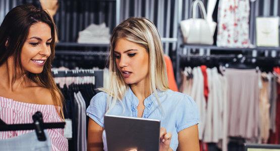 Retail worker helps customer find her size