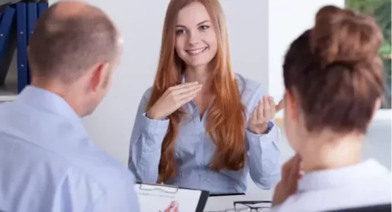 Woman during jobinterview asking questions to interviewers