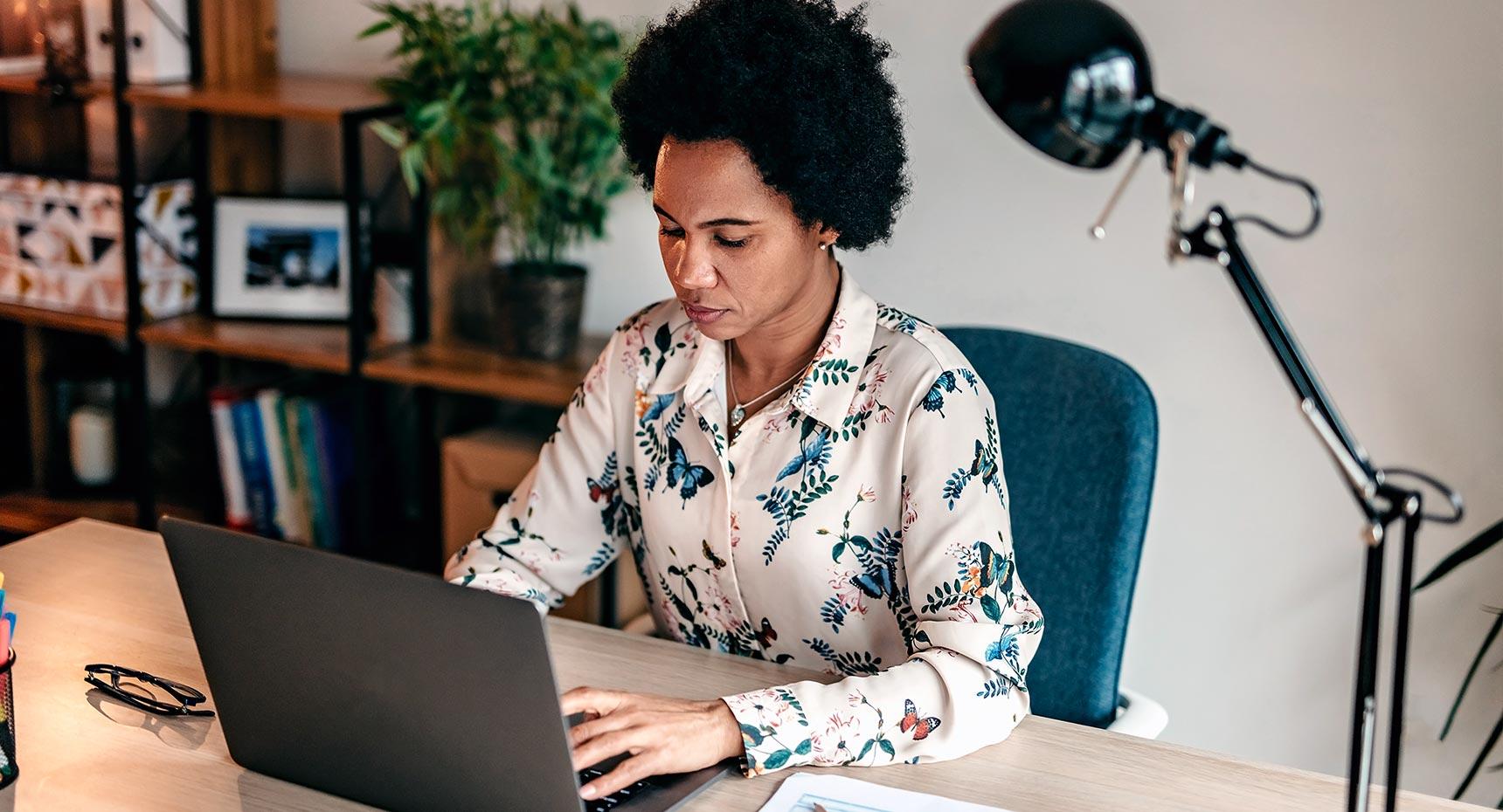 Woman working focused on her laptop