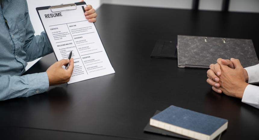 woman showing where she would make edits to a resume