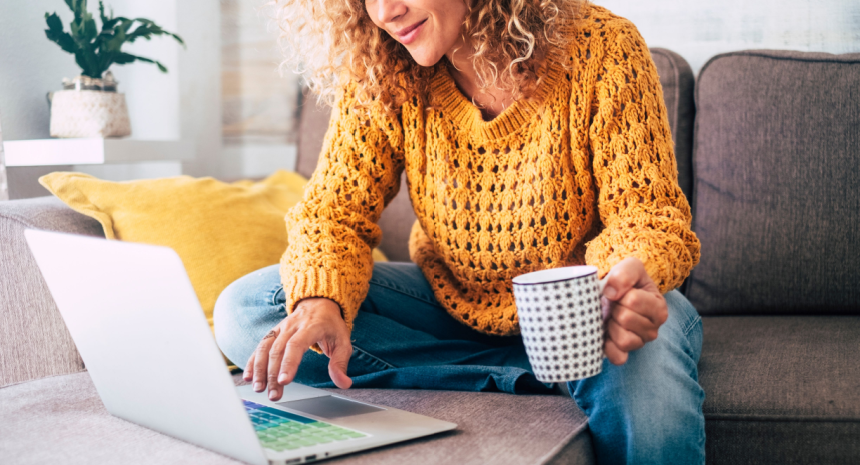 Work from home remote worker writing a resume on a laptop, wondering if you need to include your address on a resume.