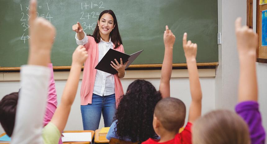 Teacher calling on students with raised hands