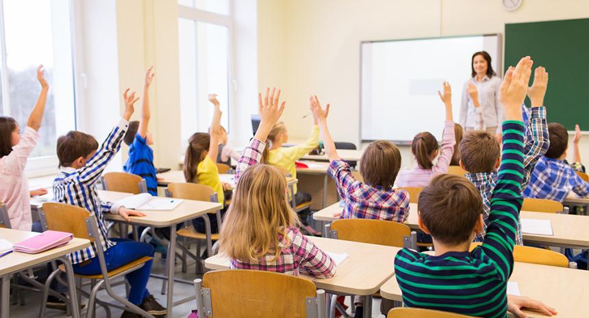 Teacher running an enthusiastic classroom