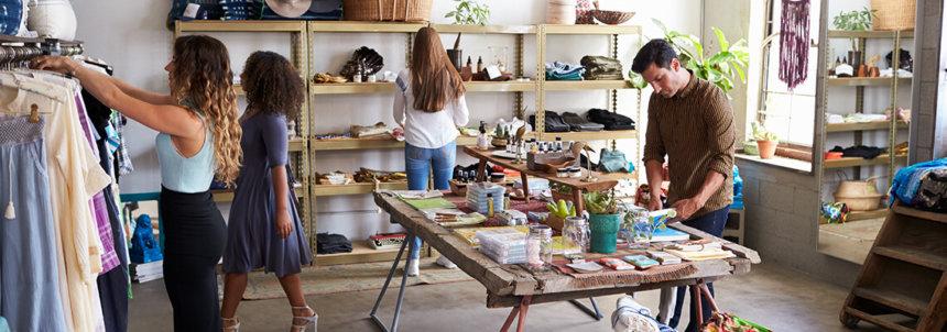 Clothing boutique filled with customers browsing