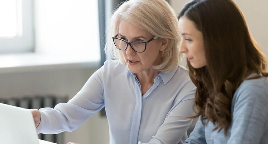 Older woman training younger woman