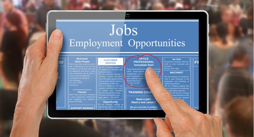 hands on tablet with job ads