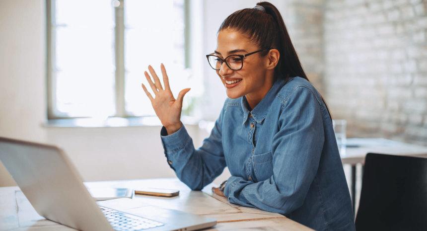 A woman happy on a virtual meeting